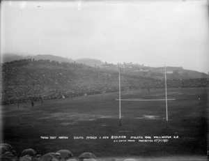 Crowd of rugby spectators in the rain at Athletic Park, Wellington