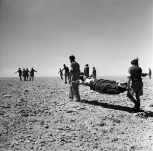 Soldiers carrying wounded on stretchers, Minqar Qaim, Egypt
