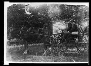 Harry Holland with Ike Askew in a carriage