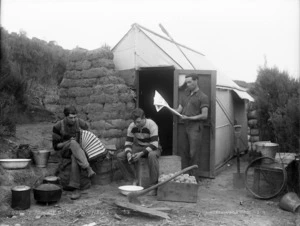 Gum diggers hut showing Joseph Kenworthy and two others, Kaitaia