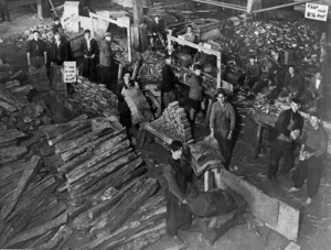 Boys cutting and packing kindling