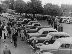 Parked cars and visitors at Palmerston North Racecourse