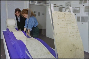 Conservators examining 1893 suffrage petition