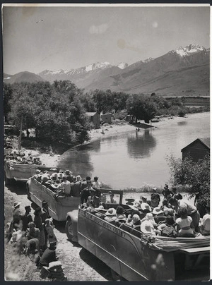 Creator unknown : Tourist buses starting the Routeburn Valley trip, Kinloch, alongside Lake Wakatipu, photographed by William Hall Raine