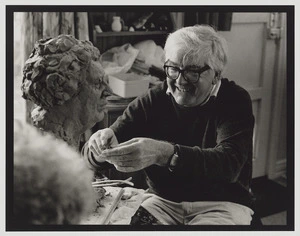 Anthony Stones models clay for portrait bust of Janet Frame