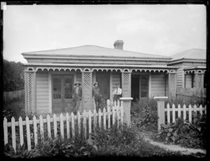 Unidentified men standing on the porch of a house in Clayton's Avenue, Wellington