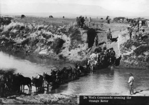Photograph of a horse drawn army transport crossing the Orange River