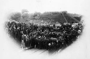 A crowd of people watching the last spike being driven in the Wellington Manawatu railway, Otaihanga, Waikanae