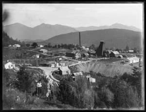 View of poppet head, Blackwater mine, with Joseph Divis and boy in foreground