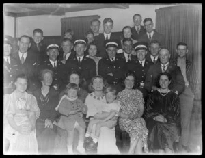 Group portrait of St Johns Ambulance men and families following presentation of awards