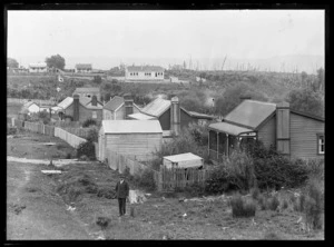 Side Road and Waiuta School with Joseph Divis in foreground
