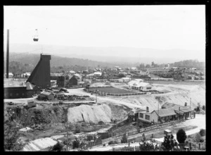 Aerial ropeway with bucket above mine and mullock heap