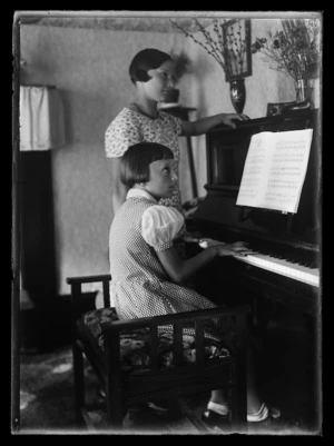 Two girls at piano