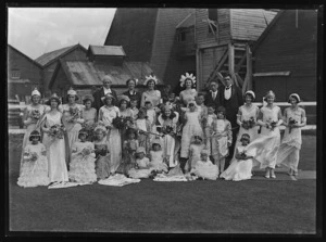 Group posed outside mine buildings during Queen Carnival