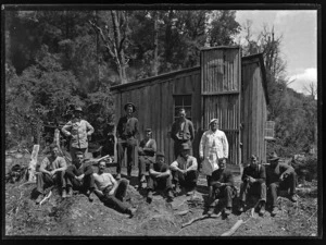 Group portrait taken outside huts at the Alexander Mine