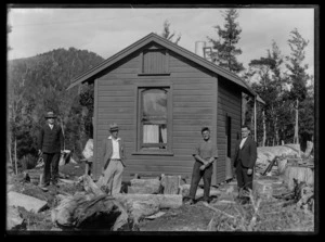 Group portrait taken outside hut at the Alexander Mine
