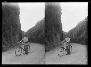 Joseph Divis with bicycle on road through Karangahake Gorge