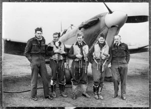 Five RAF New Zealand fighter squad members, alongside a Supermarine Spitfire, England