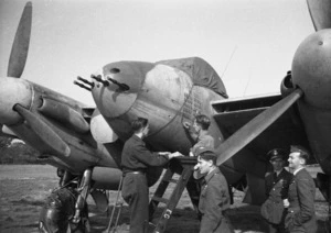 Ground crew update the record of an NZ Mosquito