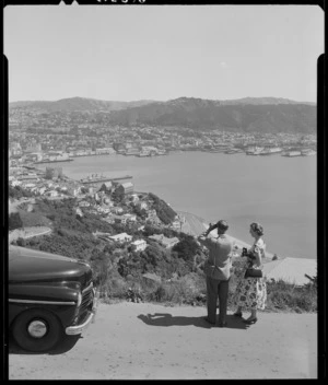 Man and woman looking over Wellington Harbour from Mount Victoria - Photograph taken by B Clark