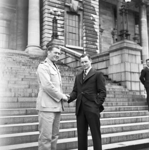 Boxers Gene Tunney and Edward Morgan shaking hands on Parliament steps, Wellington