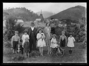 Percy and Mona Jones, with their family photogaphed with mine buildings in the background