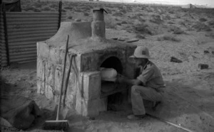 Soldier using a field oven, Egypt