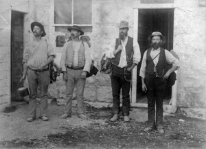 Four swagmen with their packs and billies