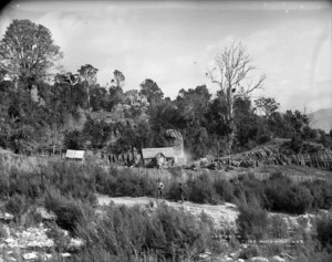 Early settler's Hut against limestone bluff, Takaka, Nelson