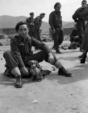 Pte. T P Noonan, Auckland, with the mascot NZASC Bruno of the No 1 Platoon