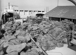 Mail bags, at the Army PO Maadi camp, being sorted and loaded onto convoy lorries for distribution to the New Zealand Units