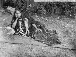 Unidentified Maori woman with piupiu - Photograph taken by William Henry Thomas Partington