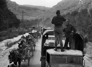 Army trucks and donkey drawn carts on the road from Damascus to Beirut
