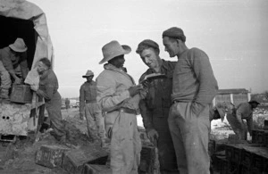South African soldier asking two New Zealand soldiers for information, Italy