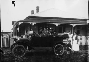 Unidentified group in and around a Model T Ford, probably in Christchurch