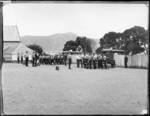 Members of the Armed Constabulary Field Force during a drill with 64 pound rifle muzzle loading guns, Mount Cook Barracks, Wellington