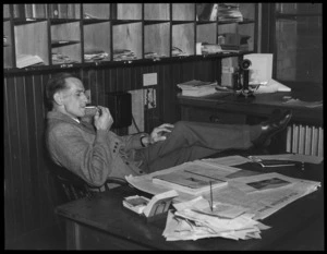 Bert Kane, Chief Reporter for The Press, in his office