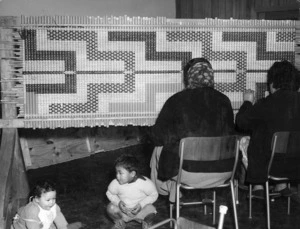 Women working on a tukutuku panel at Arohanui ki te Tangata meeting house at Waiwhetu, Lower Hutt