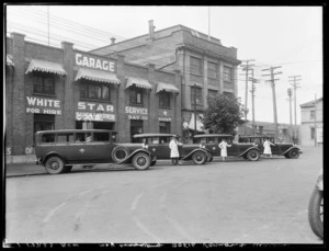 Drivers and vehicles outside the Martin & Vernon Garage, Whanganui