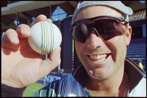 Portrait of Shane Warne holding a cricket ball