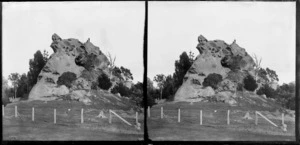 Unidentified men on top of Lean's Rock, Port Chalmers, Otago Region