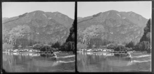 Cecil Peak Station and Lake Wakatipu, Queenstown-Lakes District, Otago Region, including an unidentified boy with a stick at the edge of the water