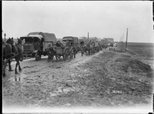 New Zealand military transport moving along a road in Le Quesnoy, France