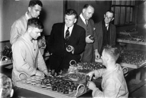 Ministerial party inspecting hand grenade factory