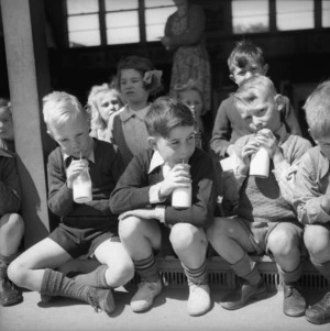 Primary school boys drinking their school milk, Linwood, Christchurch