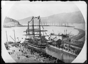 Ship adorned in flags and surrounded by crowd of onlookers at the graving dock, Lyttelton Wharf, Canterbury Region