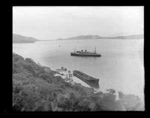 Unidentified steam ship sailing out of Port Chalmers into Otago Harbour.