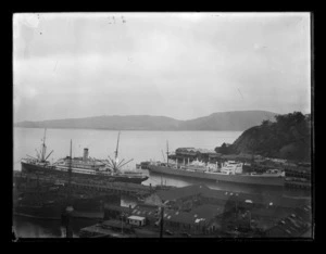 Two unidentified steam ships at Port Chalmers in full view, with two other ships, the Waipahi and the Waikouaiti, partially obscured in the foreground.