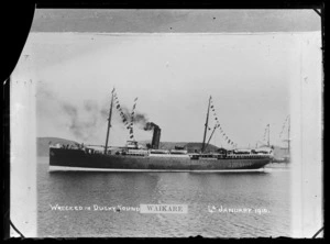 SS Waikare leaving harbour, flying bunting