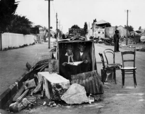 Men in a packing case shelter, after the Hawke's Bay earthquake